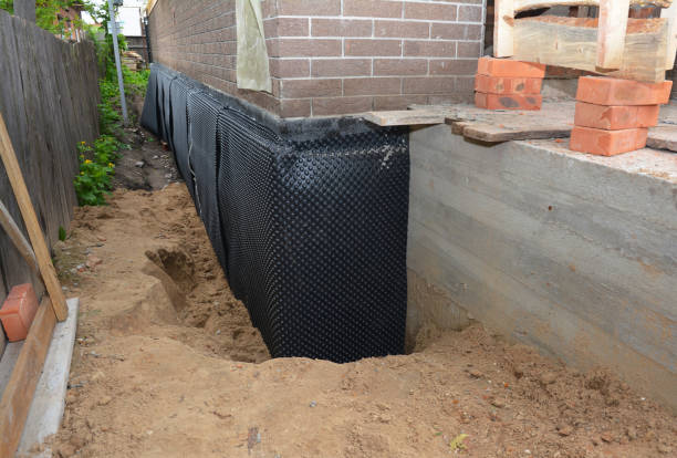 SJ Waterproofing Pros technician performing targeted Waterproofing assessment in Glenmont, OH